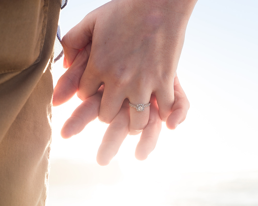 Engaged woman holding partner's hand, ready for premarital counseling in Charlotte, NC